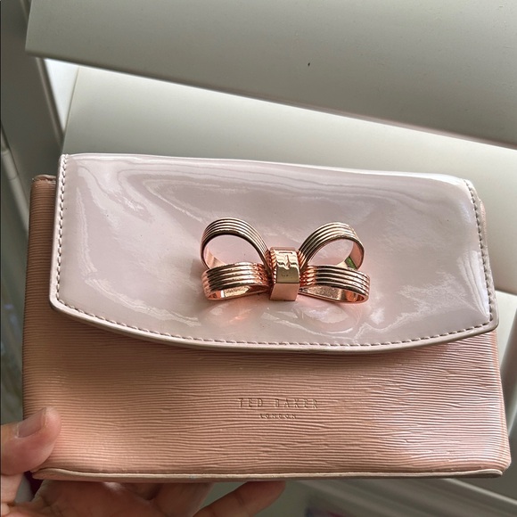Ted Baker Handbags - 🖤Ted Baker Pink Clutch with Metallic Bow